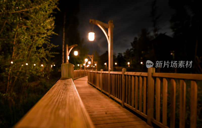 Wooden boardwalk at night